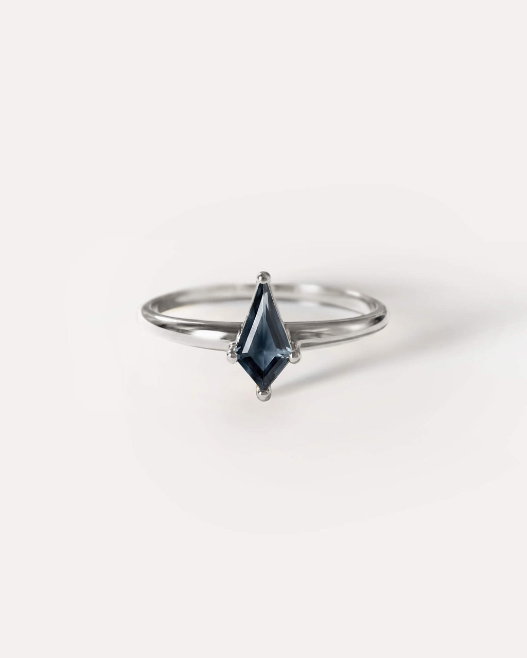 Sterling Silver ring with a marquise-shaped  Midnight Blue Sapphire  gemstone on a white background, plp_main; Material: Sterling Silver