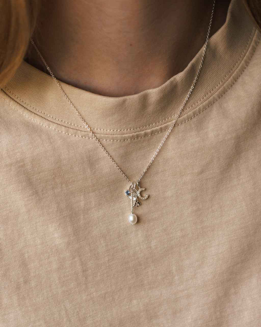Suspended Pearl Charm